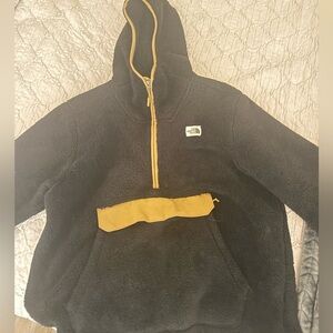 The North Face Men's Black and Gold pullover with hood